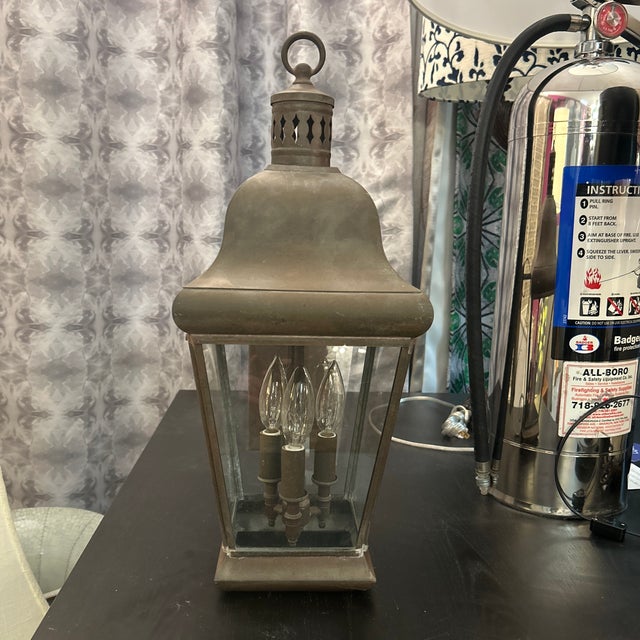 Fantastic antique metal lantern repurposed into a mounted electrified light. This lantern light shows a lot of patina...