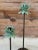 Adorable pair of staggering metal Tole palm tree candlestick holders with a Verdigris finish. Listing measurements are for...