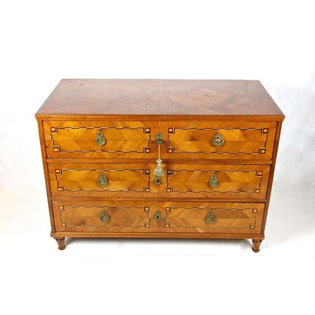 Beautiful cherry chest of drawers with inlay works from the late 18th century in Austria around 1790. This over 230 year...