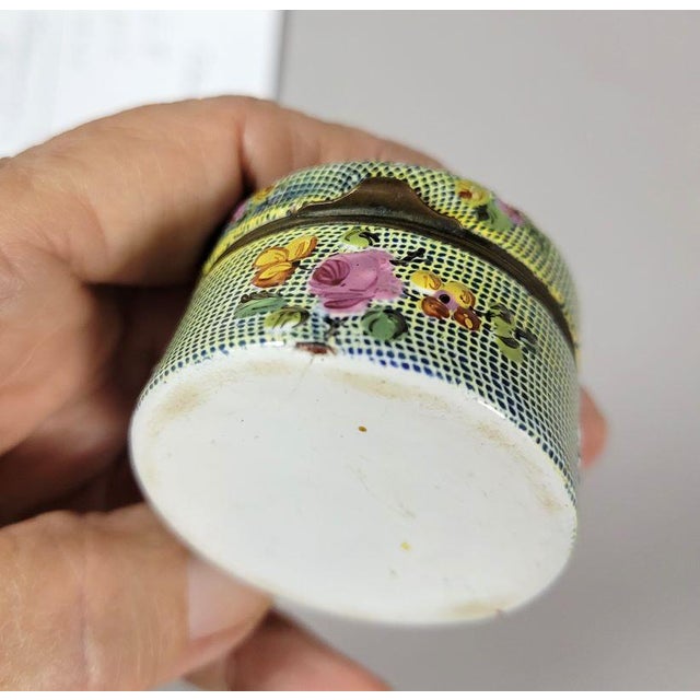 Late 18th Century Bilston English enamel snuff box with dolphin on the hinged lid. Small spays of flowers adorn the sides....