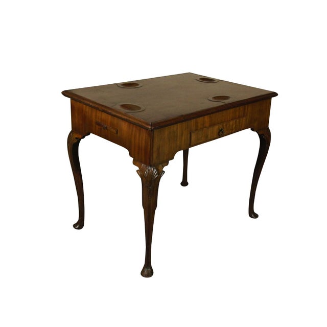 An outstanding 18th Irish Georgian walnut game table with a removable top that functions as a tea table and card playing...