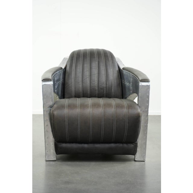Exceptionally beautiful and comfortable cowhide leather aviator design armchair finished with aluminum. : This...