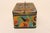 Bauhaus-style tin box with geometric shape motif in a vibrant palette of blue, yellow, black, green, and red (ca. 1930s,...