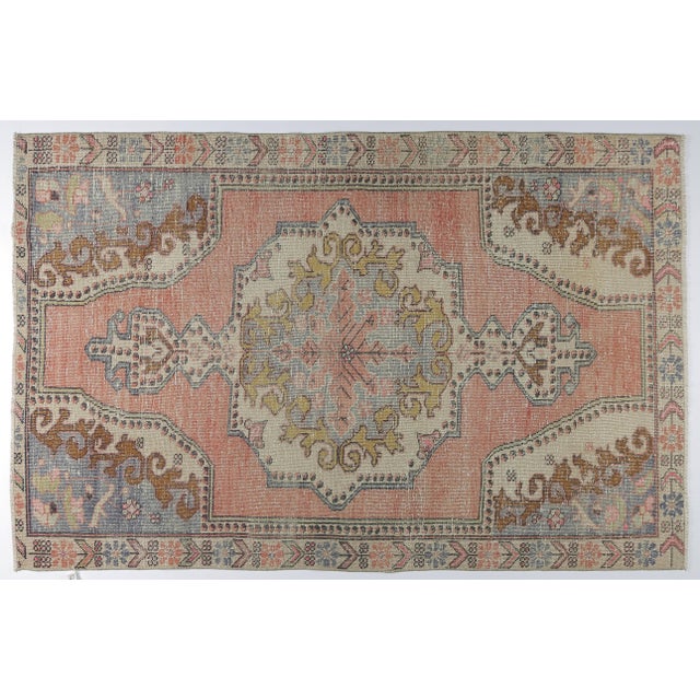 This beautiful vintage Turkish tribal rug features a bold central medallion surrounded by softly rendered tribal and...