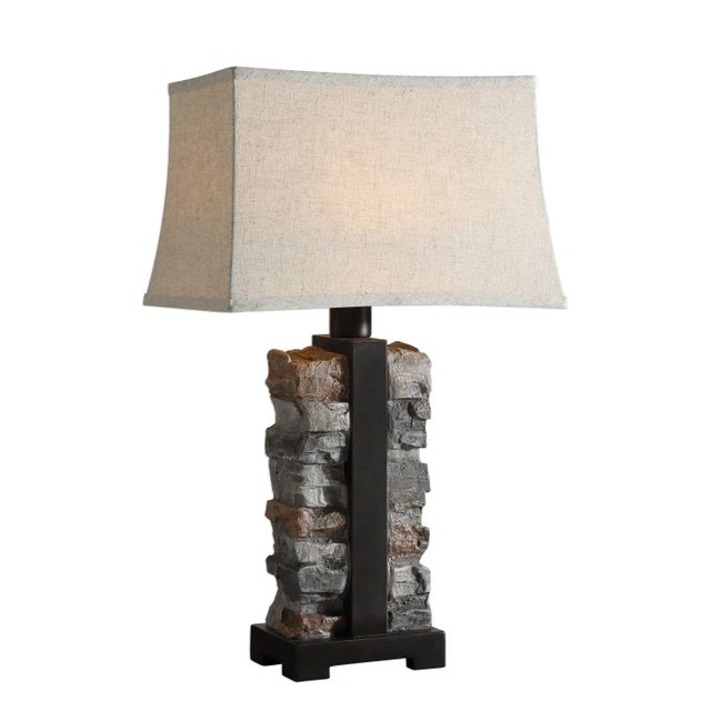 This Indoor/outdoor Lamp Features A 3-dimensional Stacked Stone Design Formed Out Of Molded Concrete, Paired With Rustic...