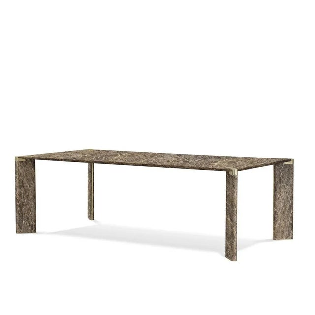 Fashioned of prized emperador dark marble, this wide dining table never fails to impress with its intricate natural...