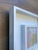 Acrylic on paper, mounted to cradled wood panel, framed in a duo style white wooden frame, 13 x 13 x 1.5. Back wired,...