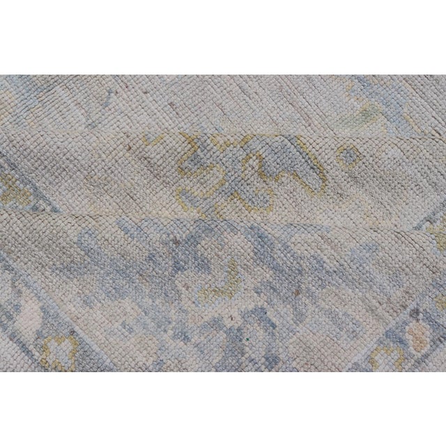 Modern Tribal Oushak With a Cream Border and Light Gray-Blue Background For Sale - Image 12 of 13