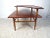 Very nice midcenturyDanish modern coffee table with two tiers. Upper-tier has a routed lip as well as a curved edge giving...