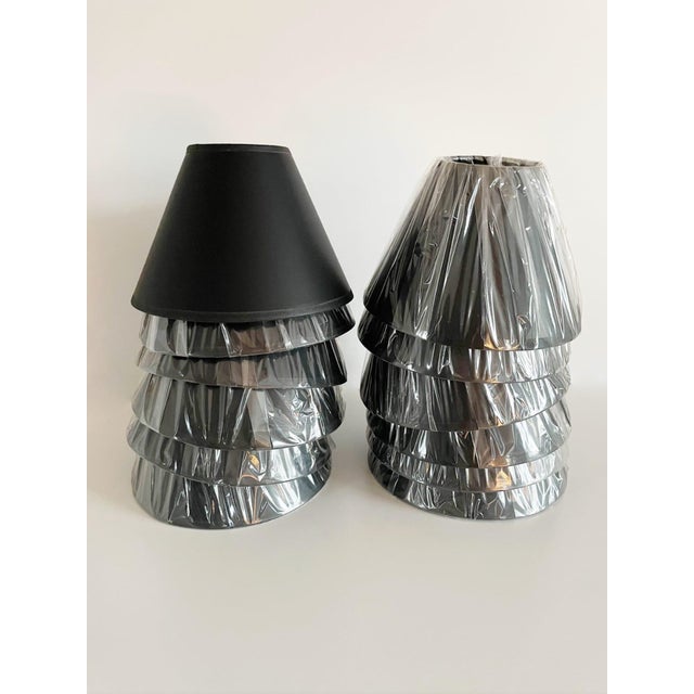 Vintage wrought iron Hivo Van Teal chandelier featuring handcrafted juicy blue lucite and twelve handmade gold gilt paper...