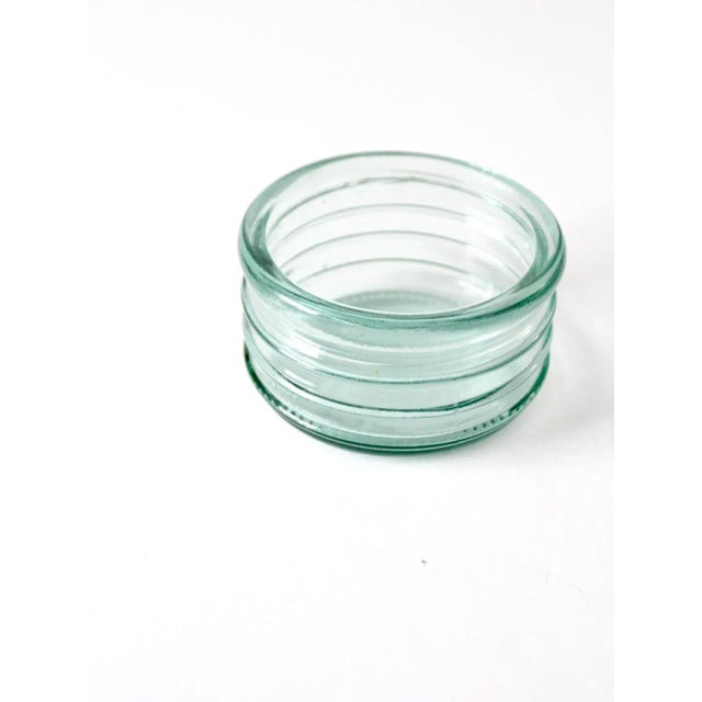 Vintage ribbed glass bowl in vibrant turquoise blue with sculptural ridged exterior detail. This industrial style glass...