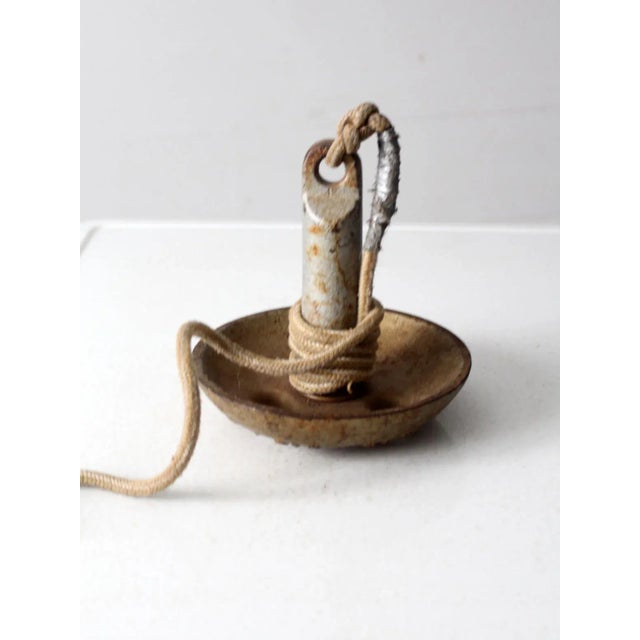 This is a vintage Roloff Mfg. Co. cast iron boat anchor, weighing 15 lbs. It features a classic mushroom design and comes...