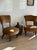 A charming set of low antique English chairs, likely late 19th century, each raised on turned walnut legs with original...