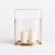 With a rare oval shaped glass hurricane, this unique candleholder is a work of art. The simple design and warm matte brass...