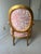 An exceptional vintage fauteuil chair featuring a hand-applied gold leaf frame and upholstered in luxurious Brunschwig &...