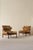 A pair of the very comfortable Inca chair in patinated brown original buffalo leather. Designed by Arne Norell, produced...