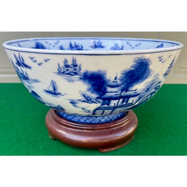 Large porcelain bowl with traditional blue and white landscape design, in the "Temple" or "Blue Willow" pattern. Use it...