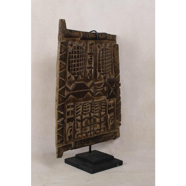 Dogon granary doors originate from the Dogon people of the Bandiagara Escarpment region of Mali. These doors protected the...