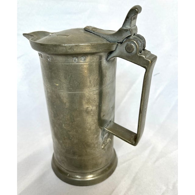 Antique 1800s pewter tankard. Monogrammed R. L., but predates Ralph Lauren. Lidded single handle pitcher. The tankard...