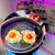 Contemporary Crispy Eggs by Alai Ganuza | Oil Painting and Acrylic of two fried eggs in a pan For Sale - Image 3 of 3