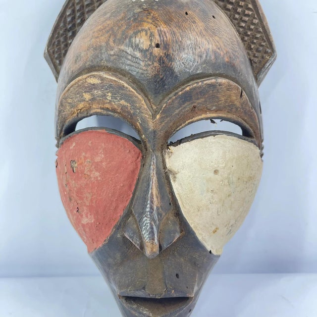 This marvelously expressive mask could be a recent example of a well-known mask type from the Boa people who live in the...