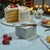 Offering a Bakelite and stainless cake server with a serrated edge. It features a butterscotch marble-patterned Bakelite...