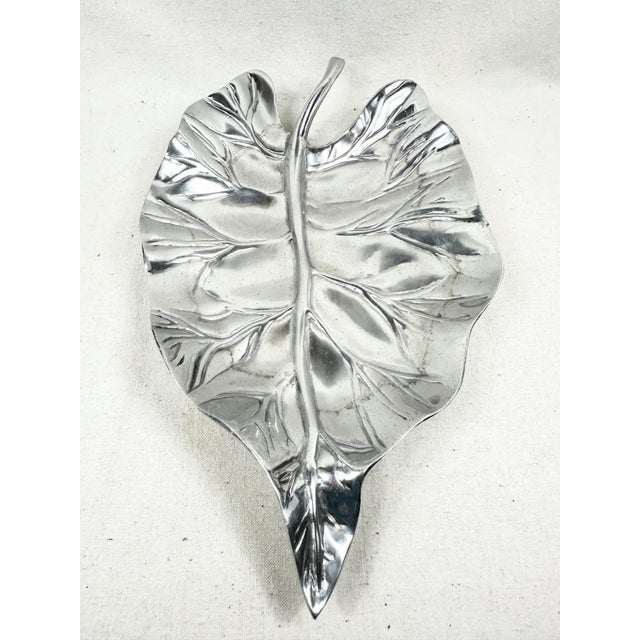 Bring a touch of organic elegance to your home with this stunning, sculptural leaf-shaped decorative tray. Artfully...