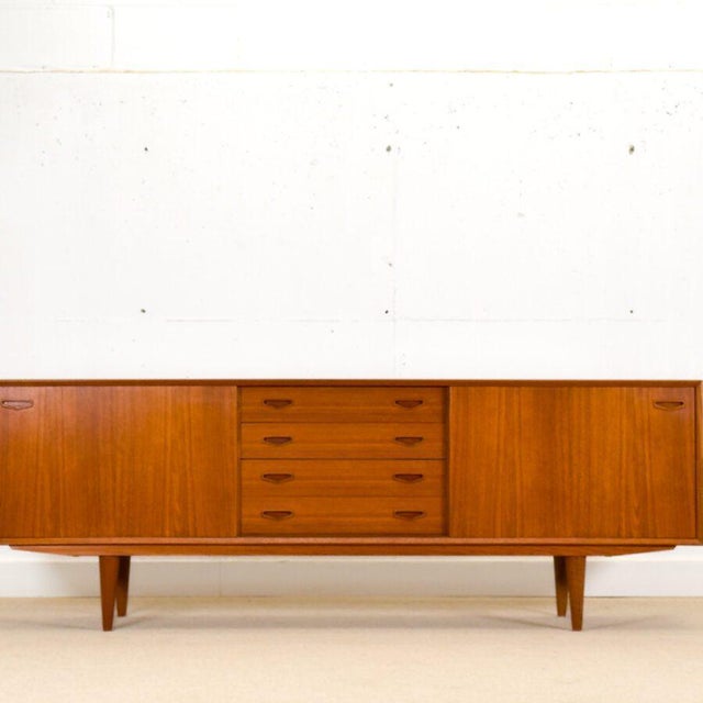 Crafted by the respected Danish cabinetmaker Clausen & Son during the golden age of Scandinavian modernism, this exquisite...