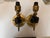 Matching pair of Maison Charles French wall sconces from the 1930s, each hand formed as a fist holding a torch, in solid...