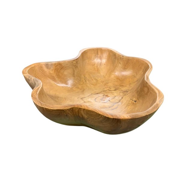 This teak live edge bowl is a unique piece showcasing the natural beauty of teak wood. Crafted by skilled artisans, its...