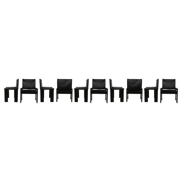 Set of ten “Monk” dining chairs designed by Afra and Tobia Scarpa for Molteni in 1973. Made of black leather and black...