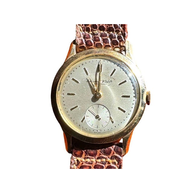 Refined and timeless, this 1950s IWC Calatrava-style wristwatch is crafted in solid 14k gold and powered by the renowned...