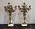 A wonderful complimenting pair of gilt bronze marble based Louis XVI style cherub candleabras with bronze mounts. This...