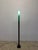 Postmodern Koch and Lowy floor lamp with conical green glass diffuser shade and a black base circa 1990s.