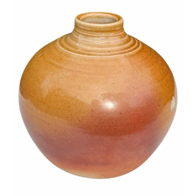 Vintage studio pottery by Mark Heimann featuring a rounded, sculptural form with a short stepped neck. The vessel is...