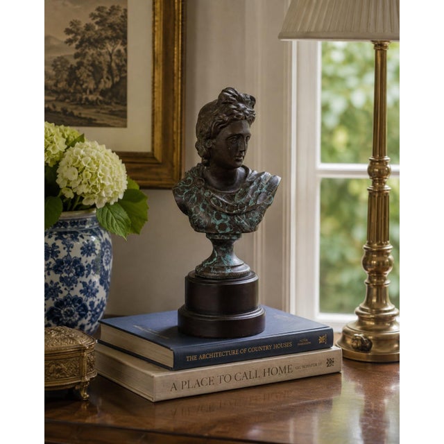 A handsome late 20th-century brass bust depicting Apollo Belvedere, modeled with an idealized classical profile, swept...