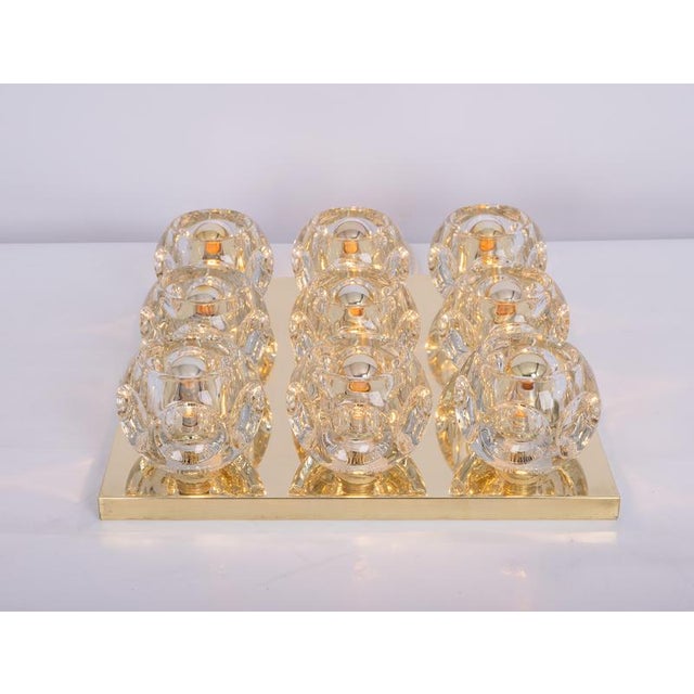 Fantastic mid-century flush mount by peill & putzler, germany, manufactured, circa 1970-1979. 9 cube glasses over a brass...