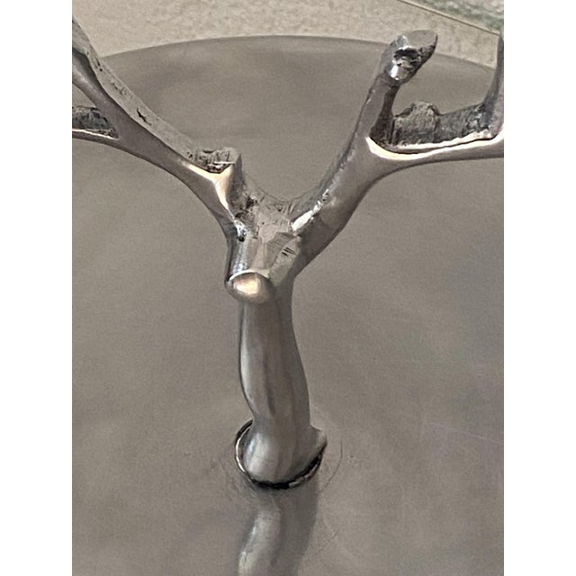 Polished aluminum tray surmounted by a tree on which a bird perches. Uncommon and original vintage piece, with a solid...