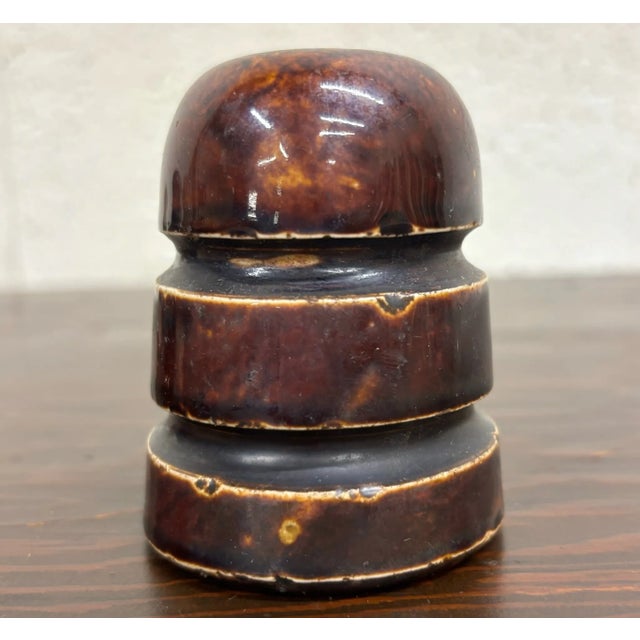 This is a gorgeous antique dark brown ceramic mushroom cap glazed insulator with a gorgeous color. “B” on top. Several...