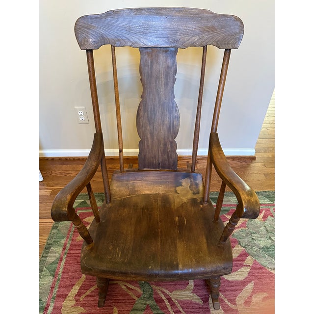 Beautiful antique wooden rocking chair in a Boston-style.
