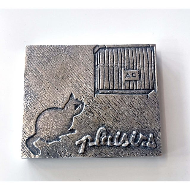 A silvered cast bronze rectangular paperweight by Parisian art jeweler Line Vautrin (1913-1997) circa 1940s. A lovely...