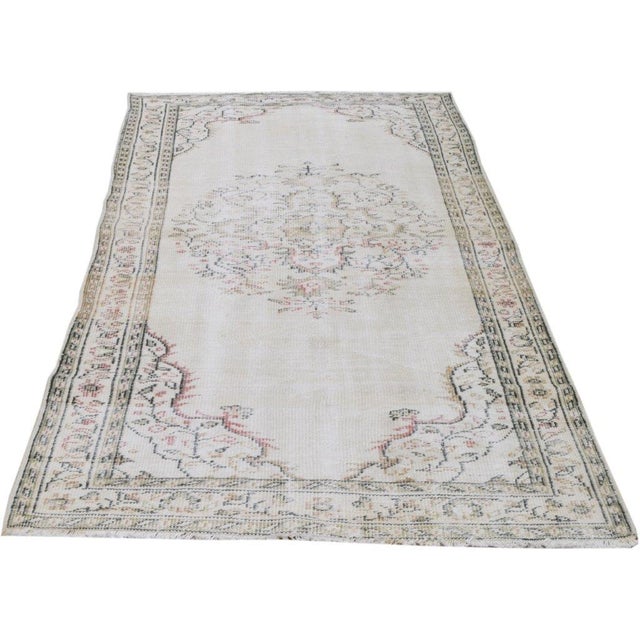 Hand-knotted with care using traditional rug-making techniques, this wool rug blends timeless craftsmanship with a modern...