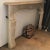 DETAILS This antique, French fireplace is carved with a shaped, overhanging mantel surmounting an ogee frieze with a...