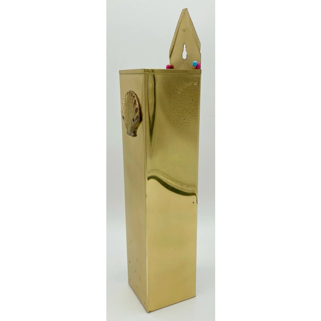 Vintage brass matchstick holder with detailed clam shell embellishment. Hole for hanging. Fabulous patina.