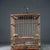 Antique Rosewood Birdcage With Gemstone Inlay and Porcelain Feeders For Sale In Los Angeles - Image 6 of 9