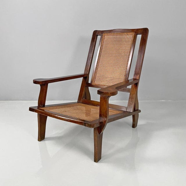 Armchair with rectangular base. The seat and backrest are covered in Vienna straw. The structure is entirely made of wood...