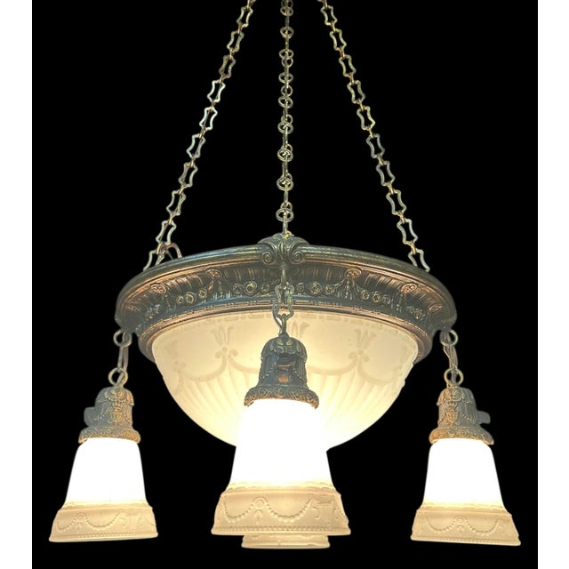 This gorgeous chandelier is made up of all original parts, including the shades! 4 shades and a large matching glass dome...