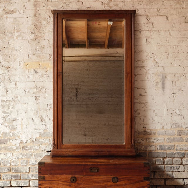 Add understated French elegance to your space with this 19th century French wooden framed mirror, a timeless piece defined...