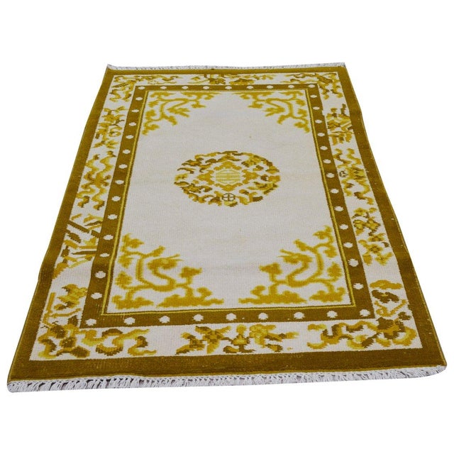 Hand-knotted with care using traditional rug-making techniques, this wool rug blends timeless craftsmanship with a modern...