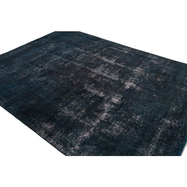 From our new collection of overdyed rugs, a vintage 9x12 Persian rug originating circa 1970-1980 or possibly earlier. On...